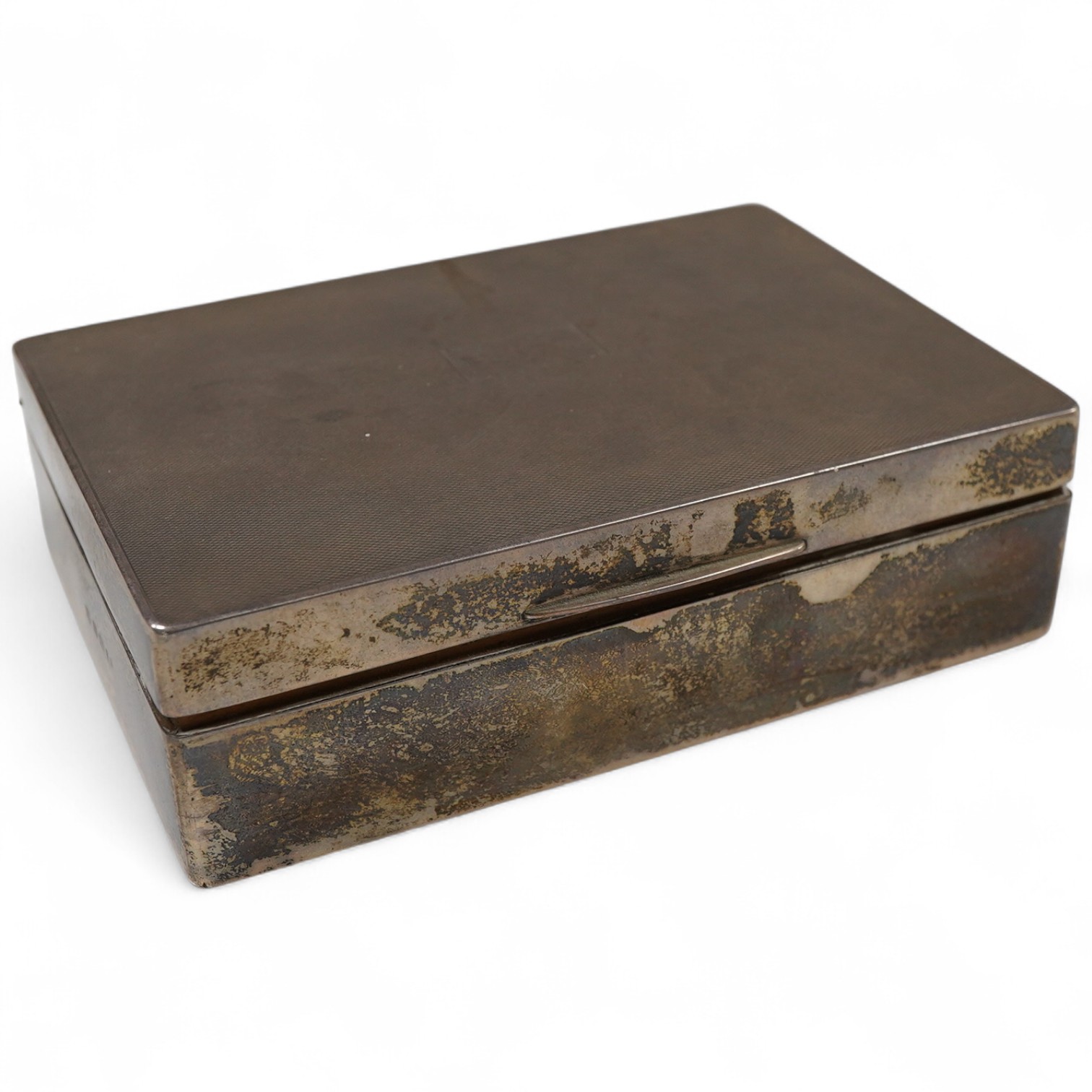 A George V engine turned silver mounted rectangular cigarette box, by William Neale Ltd, Birmingham, 1935, 16.2cm.